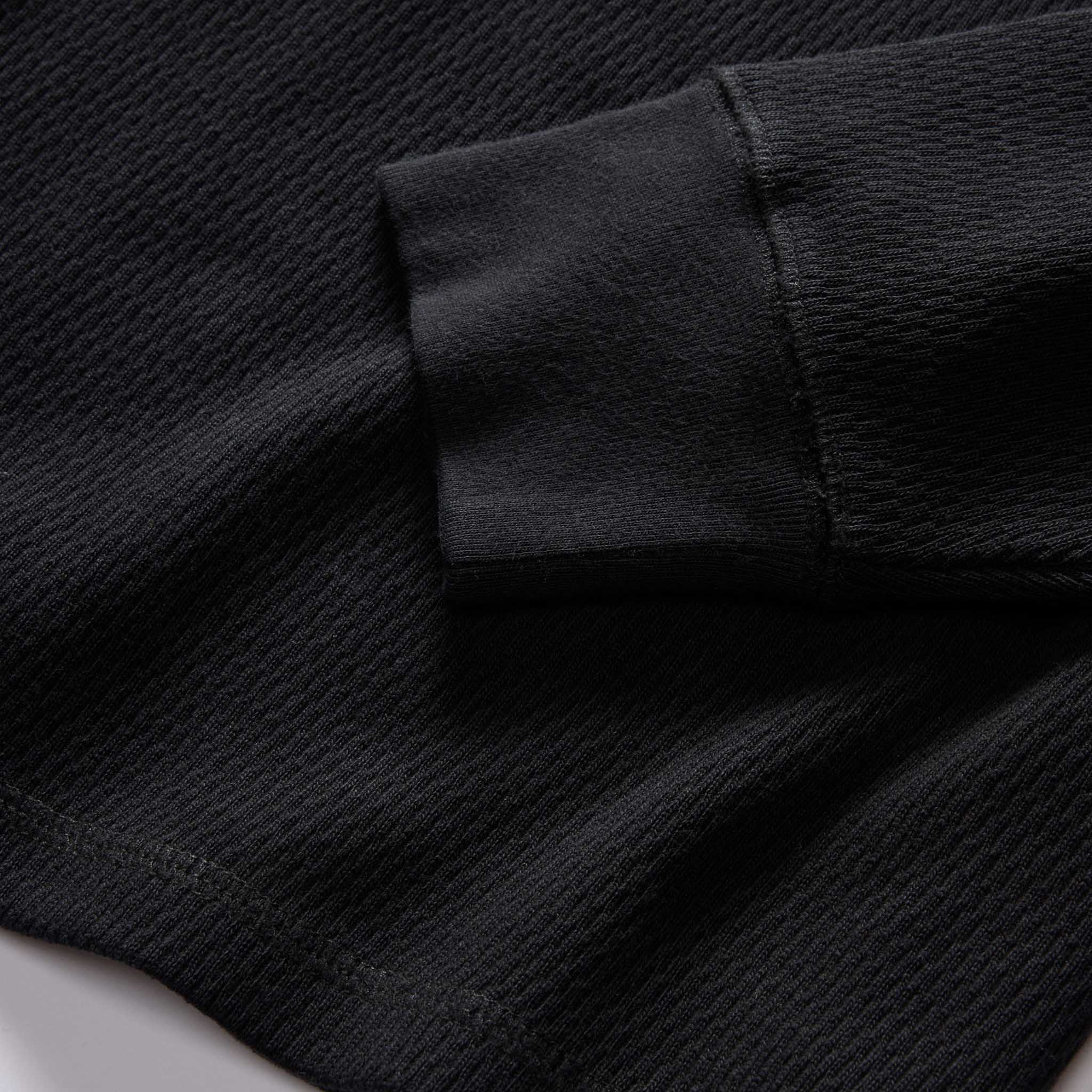 material shot of the rubbed cuff on The Organic Cotton Waffle Henley in Coal, Knits by Taylor Stitch