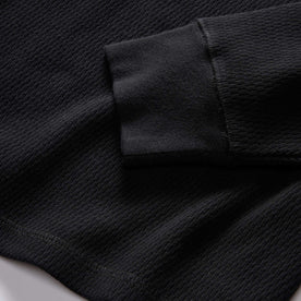 material shot of the rubbed cuff on The Organic Cotton Waffle Henley in Coal