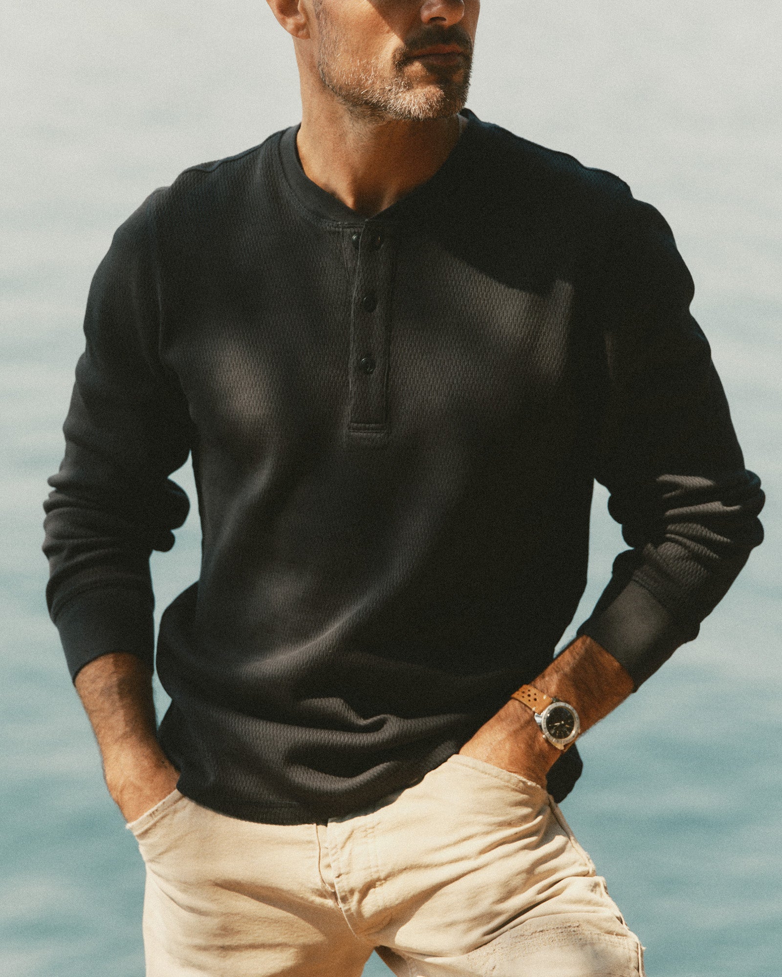 fit model in The Organic Cotton Waffle Henley in Coal, Knits by Taylor Stitch