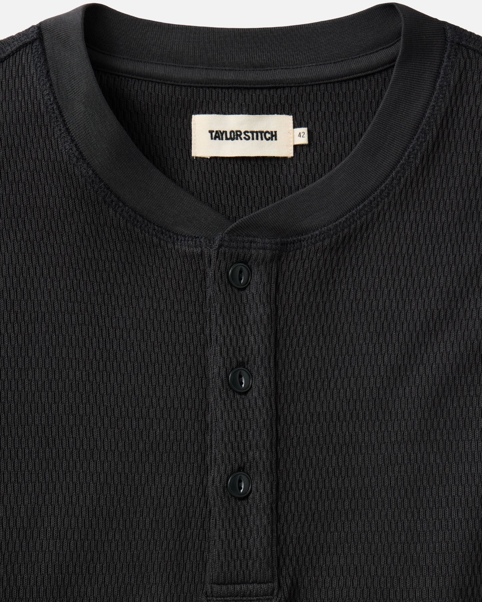 fit model showing the front of The Organic Cotton Waffle Henley in Coal, Knits by Taylor Stitch