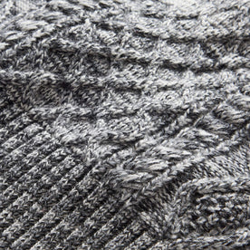 material shot of the cable knit on The Orr Beanie in Marled Coal
