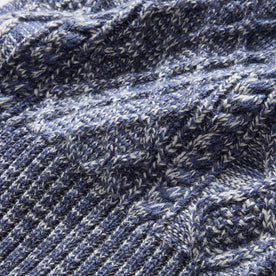 material shot of the cable knit on The Orr Beanie in Marled Indigo