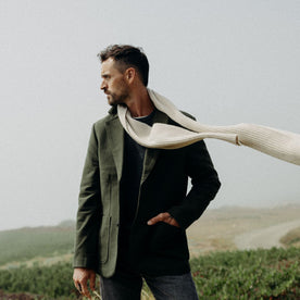 fit model with The Rib Scarf in Oat Heather around his neck