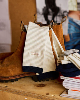 The Ribbed Sock in Natural on a boot, Accessories by Taylor Stitch