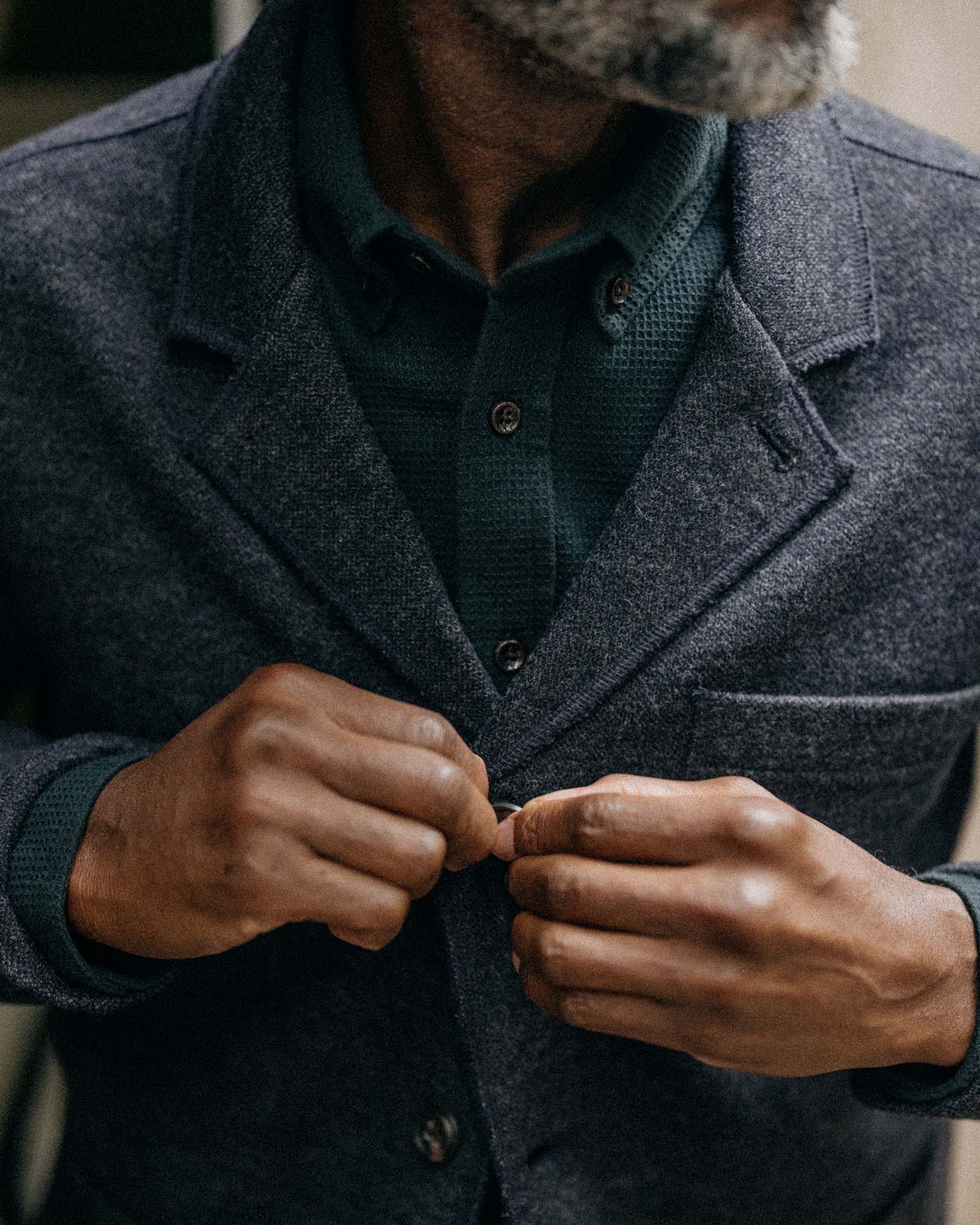 fit model buttoning The Ridgewood Cardigan in Navy Birdseye Wool, Outerwear by Taylor Stitch