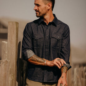 fit model adjusting his sleeves in The Saddler Shirt in Dark Navy Twill