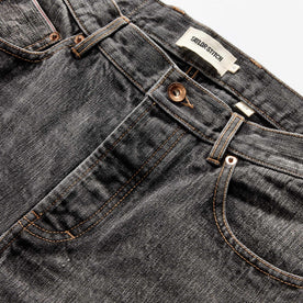 material shot of the button fly on The Slim Jean in Black 1-Year Wash Selvage Denim, closed