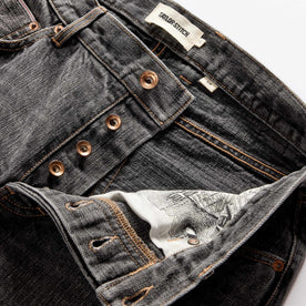 material shot of the button fly on The Slim Jean in Black 1-Year Wash Selvage Denim