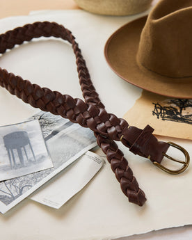 editorial image of The Braided Belt in Dark Brown laid out on paper, Accessories by Taylor Stitch