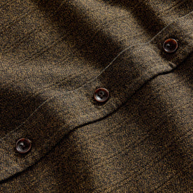 material shot of the horn buttons on The Utility Shirt in Tarnished Brass Herringbone