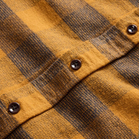 material shot of the horn buttons on The Yosemite Shirt in Saffron Buffalo Check