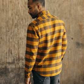 fit model showing the back of The Yosemite Shirt in Saffron Buffalo Check
