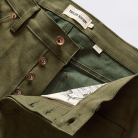 material shot of the button fly on The Democratic Jean in Olive Nihon Menpu Selvage