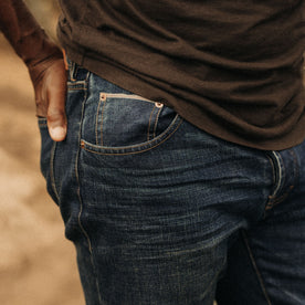 fit model showing the front pockets on The Democratic Brushed Back Jean in Collins Resin Wash Selvage Denim