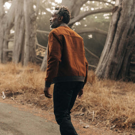 fit model showing the back of The Bomber Jacket in Tarnished Copper Moleskin