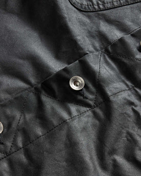 material shot of the buttons on The Long Haul Jacket in Coal Waxed Canvas, Outerwear by Taylor Stitch