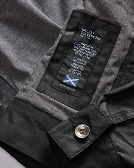 material shot of the Halley Stevensons label on The Long Haul Jacket in Coal Waxed Canvas, Outerwear by Taylor Stitch