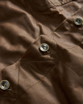 material shot of the buttons on The Long Haul Jacket in Dark Khaki Waxed Canvas, Outerwear by Taylor Stitch