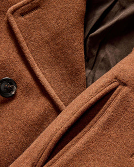 material shot of the horn buttons and pockets on The Mariner Coat in Tarnished Copper Wool, Outerwear by Taylor Stitch