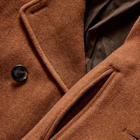 material shot of the horn buttons and pockets on The Mariner Coat in Tarnished Copper Wool