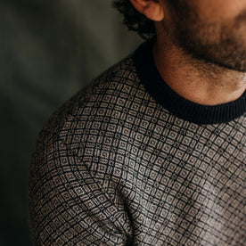 fit model showing the two-color knit on The Otto Sweater in Coal Merino