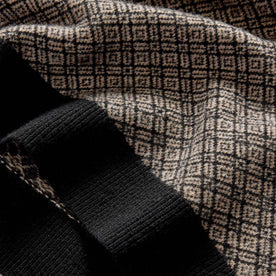 material shot of the ribbed hem on The Otto Sweater in Coal Merino