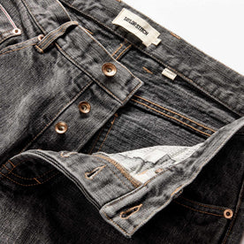 material shot of the button fly on The Democratic Jean in Black 1-Year Wash Selvage Denim