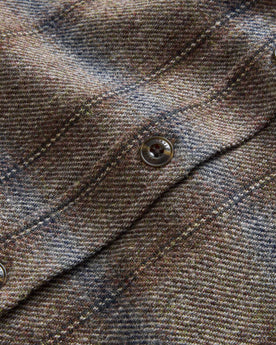 material shot of the buttons on The CPO Shirt in Dark Brick Plaid Wool, Wovens by Taylor Stitch