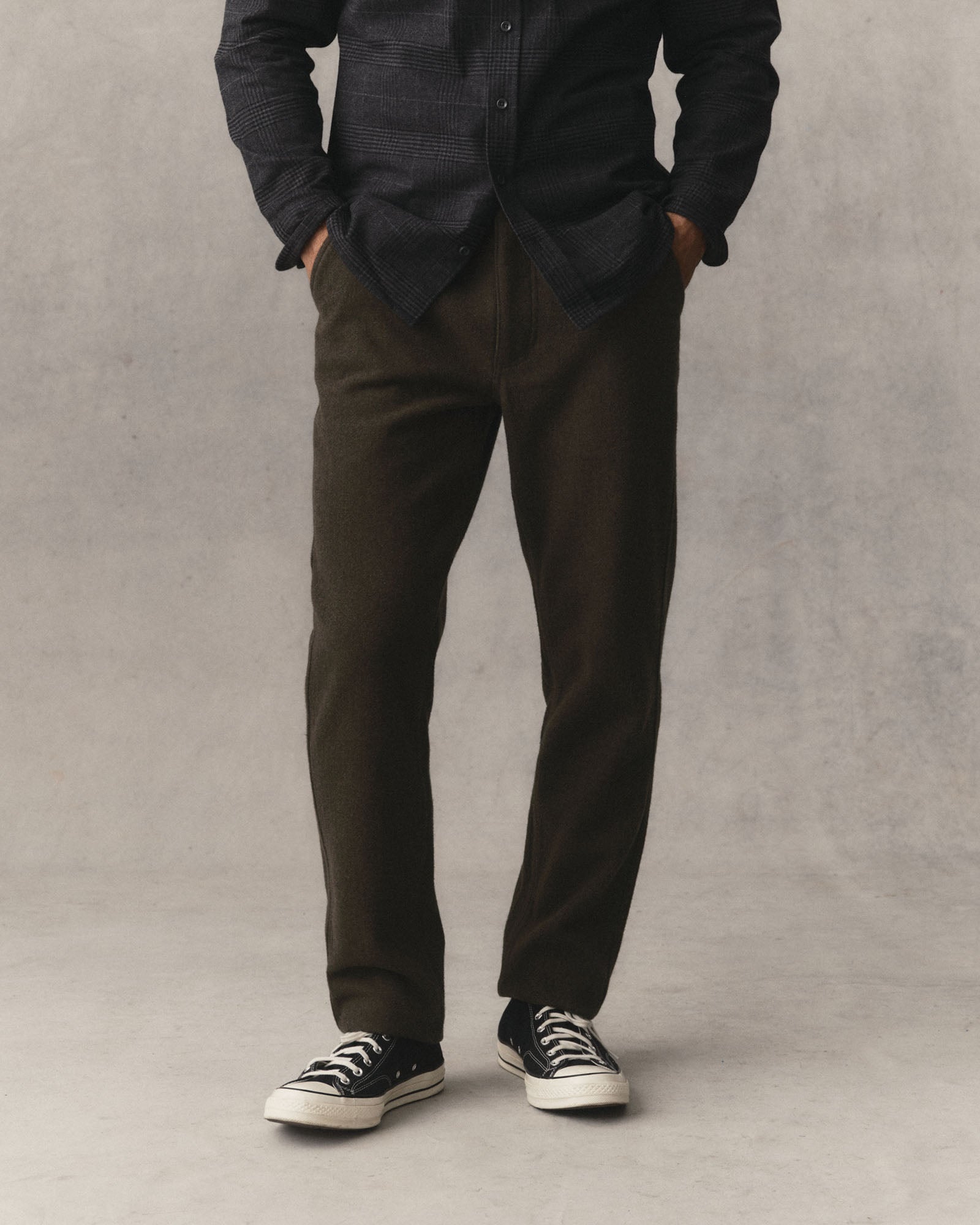 fit model with his hand in the pocket of The Carnegie Pant in Army Herringbone Wool, Bottoms by Taylor Stitch
