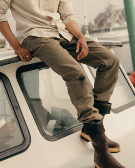 fit model walking wearing The Chore Pant in Stone Chipped Canvas, Bottoms by Taylor Stitch