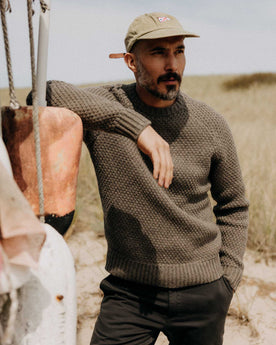 fit model adjusting the cuffs on The Fisherman Sweater in Taupe Merino, Knits by Taylor Stitch