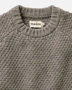 fit model standing on a boat wearing The Fisherman Sweater in Taupe Merino, Knits by Taylor Stitch