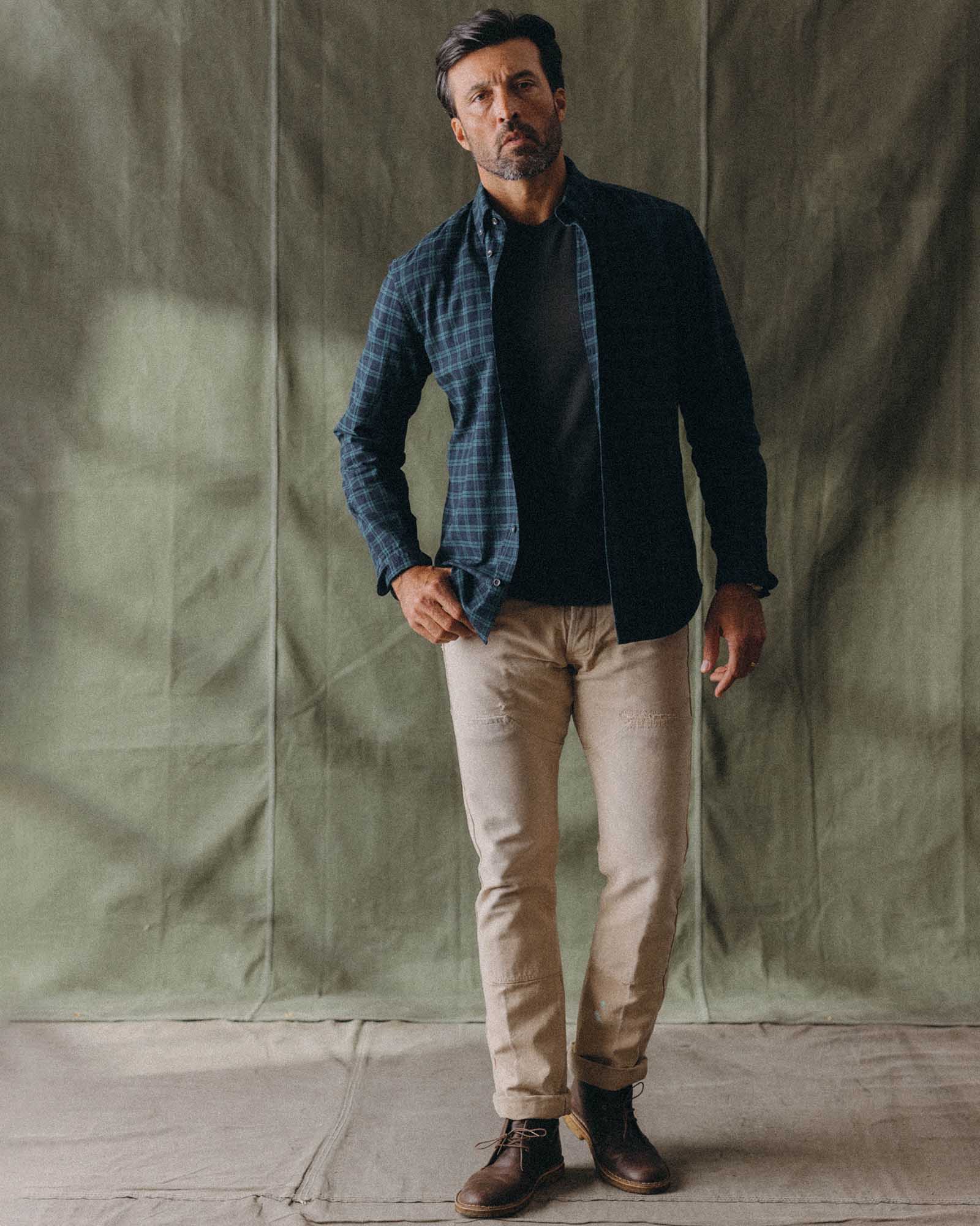 fit model with his arms crossed wearing The Jack in Blackwatch Plaid, Wovens by Taylor Stitch