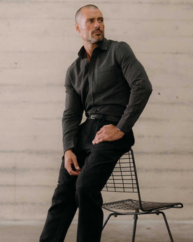 fit model sitting wearing The Jack in Roped Black Indigo, Wovens by Taylor Stitch