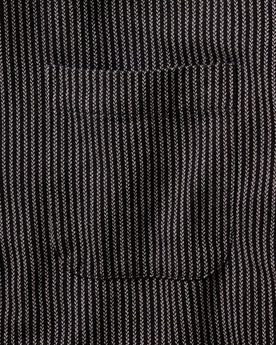 material shot of the back button on the collar on The Jack in Roped Black Indigo, Wovens by Taylor Stitch