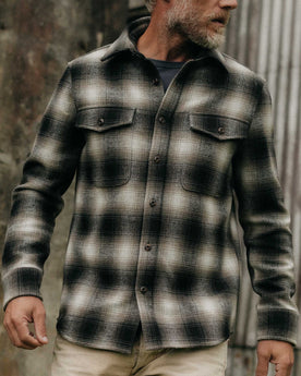 fit model posing on The Maritime Shirt Jacket in Olive Plaid, Wovens by Taylor Stitch