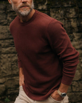 fit model with his hands in his pockets wearing The Organic Cotton Waffle Crew in Burgundy, Knits by Taylor Stitch