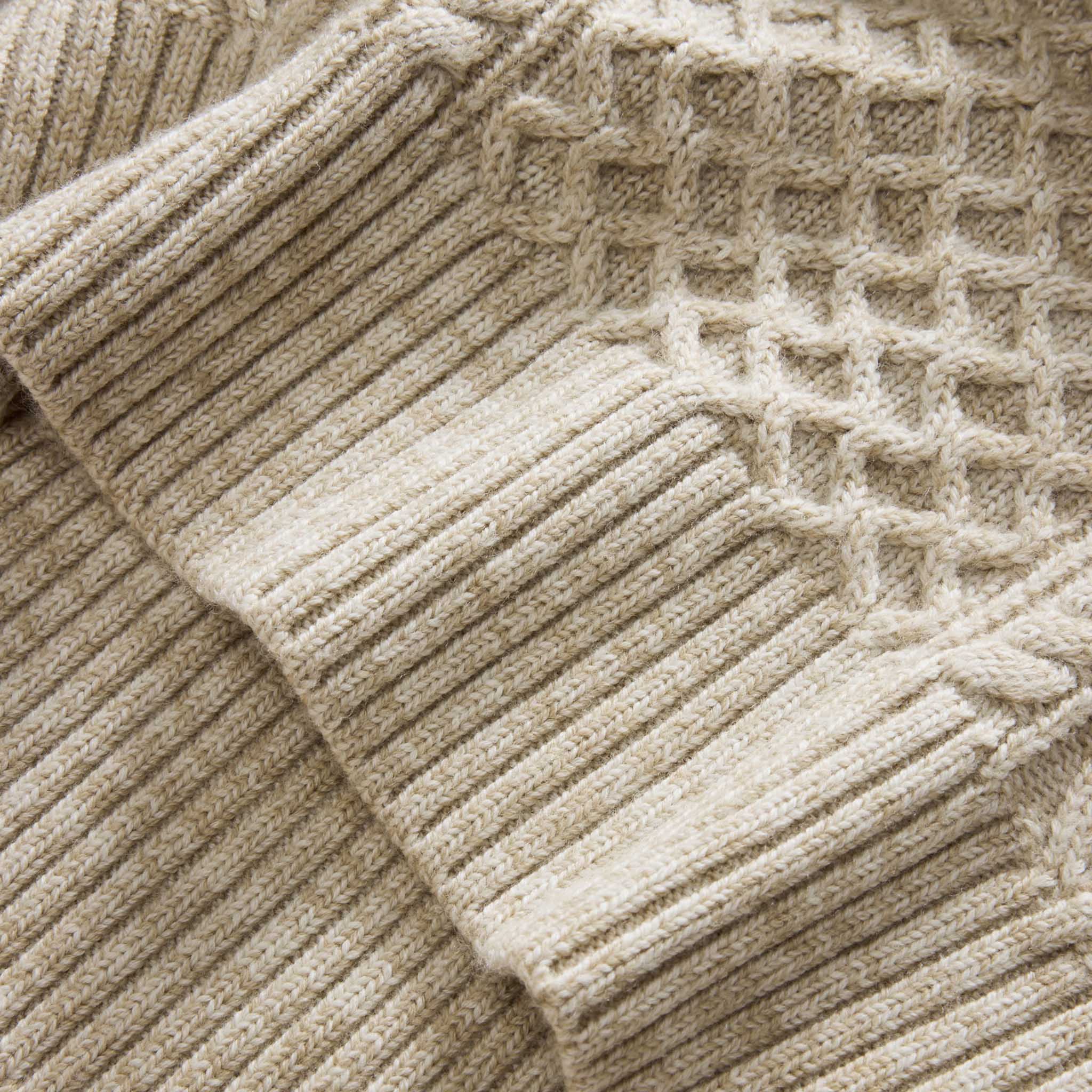 material shot of the hem on The Orr Sweater in Marled Oat Merino, Knits by Taylor Stitch