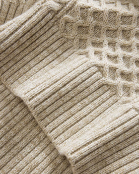 material shot of the hem on The Orr Sweater in Marled Oat Merino, Knits by Taylor Stitch