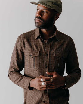 fit model posing in The Saddler Shirt in Burnt Caramel Check Wool, Wovens by Taylor Stitch