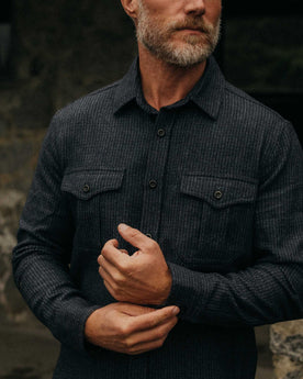 fit model adjusting the cuffs on The Saddler Shirt in Midnight Check Wool, Wovens by Taylor Stitch