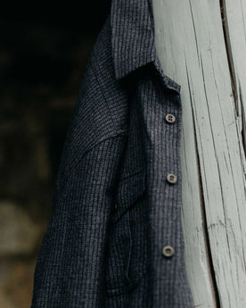 editorial image of The Saddler Shirt in Midnight Check Wool hanging, Wovens by Taylor Stitch