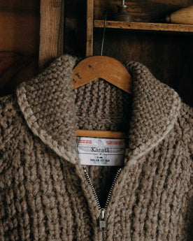 editorial image of The Seawall Hand-Knit Sweater in Heather Sable hanging, Knits by Taylor Stitch