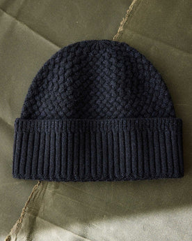 editorial flatlay of The Textured Knit Beanie in Heather Navy Merino, Accessories by Taylor Stitch
