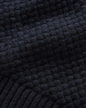 material shot of the texture on The Textured Knit Beanie in Heather Navy Merino, Accessories by Taylor Stitch