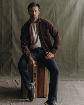 fit model posing in The Utility Shirt in Burgundy Corduroy, Wovens by Taylor Stitch