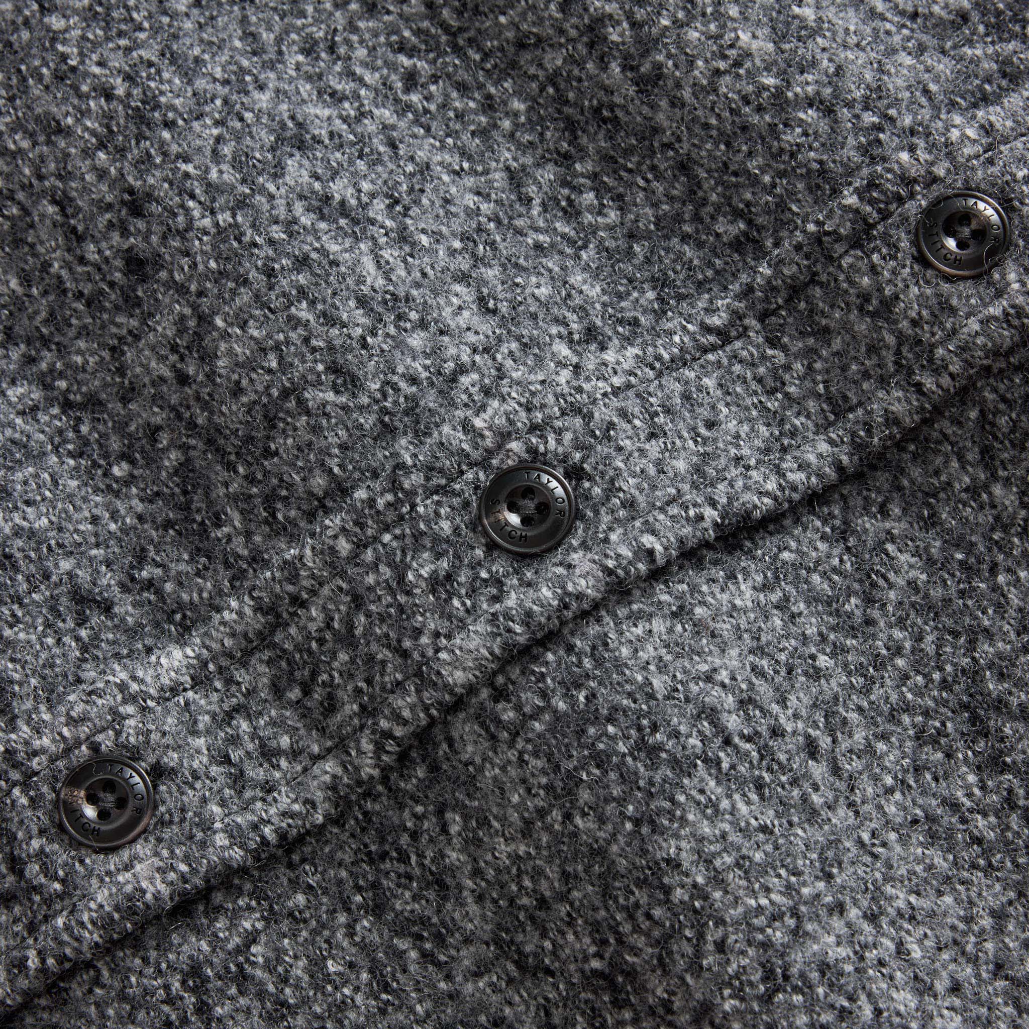 material shot of the buttons on The Connor Overshirt in Heather Ash Boucle, Wovens by Taylor Stitch
