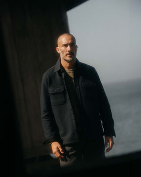 fit model adjusting the cuffs wearing The Connor Overshirt in Dark Navy Boucle, Wovens by Taylor Stitch