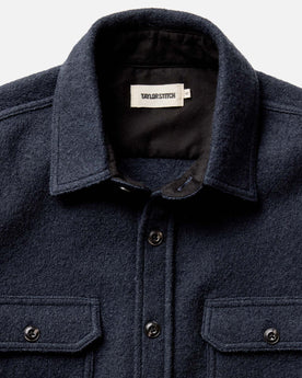 editorial image of The Connor Overshirt in Dark Navy Boucle hanging, Wovens by Taylor Stitch