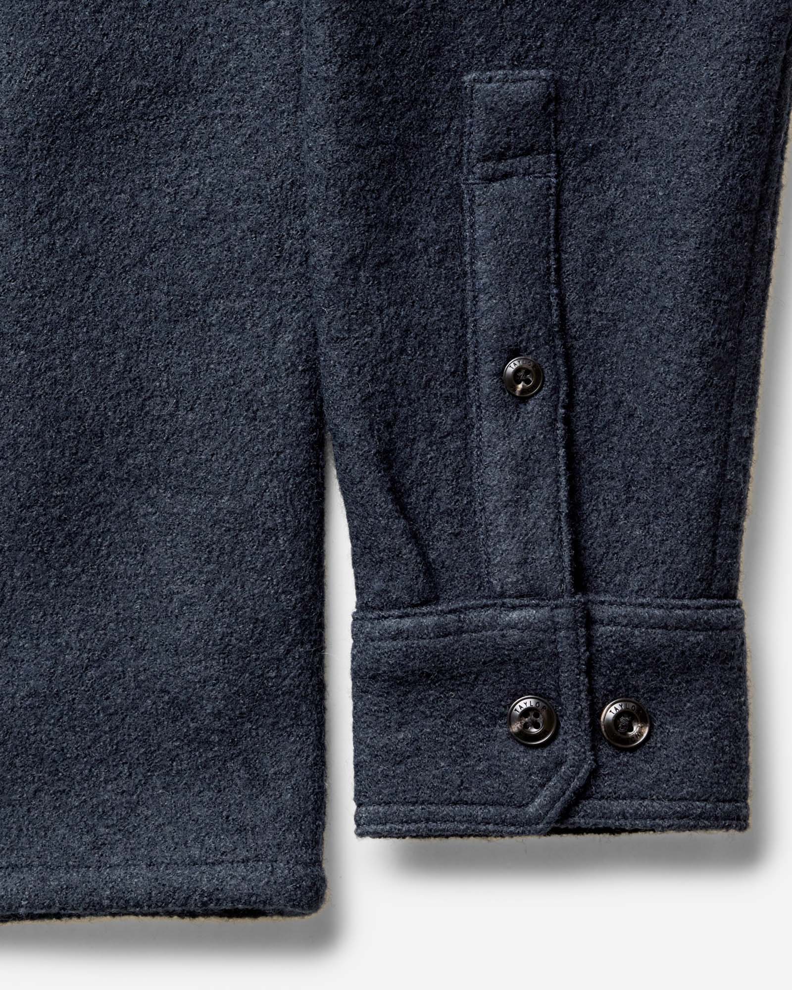 material shot of the buttons on The Connor Overshirt in Dark Navy Boucle, Wovens by Taylor Stitch